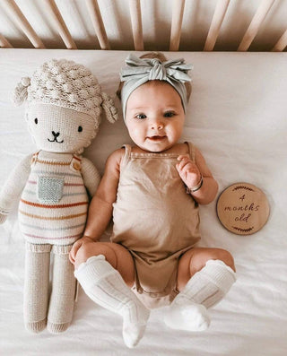 Baby in knee high socks