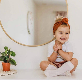 baby girl in knee high socks