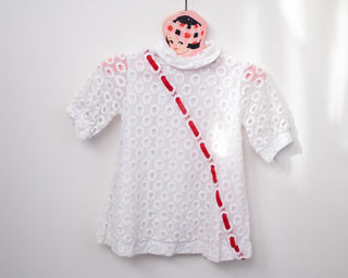 vintage white lace dress with red ribbon