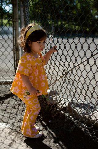Girls retro vintage mustard yellow top with pink flowers