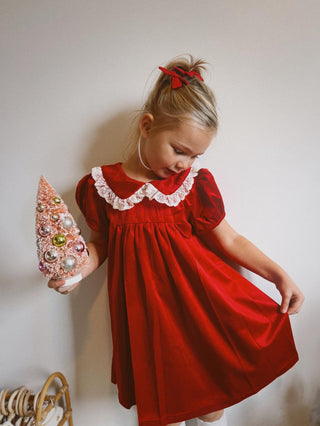 Girl in red velvet christmas dress