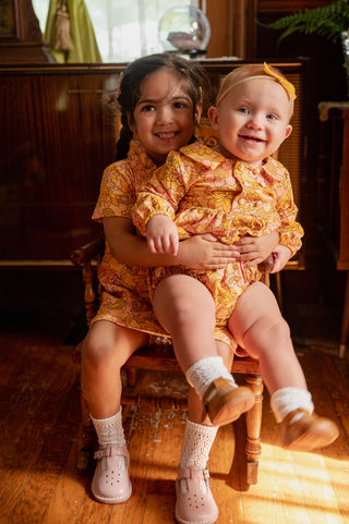 toddler and baby in retro outfits