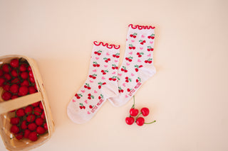 White socks with red cherries and pink hearts 
