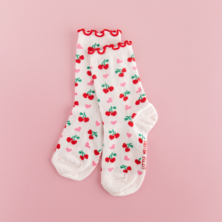 White socks with red cherries and pink hearts 

