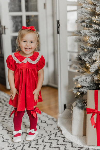 girl in red velvet dress