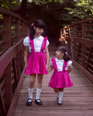 Pink corduroy pinafore skirt for baby toddler girls