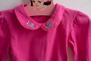 Pink baby bodysuit