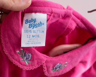 Pink baby bodysuit