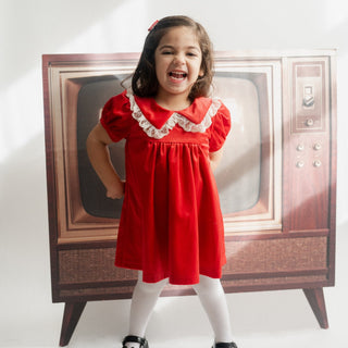 Girl in red velvet christmas dress